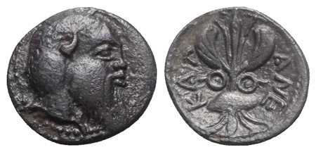 Sicily, Katane, Litra, ca. 461-450 BC. AR (g 0,48; mm 10; h 6). Head of Silenos r.; Rv. KAT-ANE, Winged thunderbolt; two shields flanking. Boehringer, Kataneische, Series I, Li 1; HGC 2, 587. Dark patina, near extremely fine