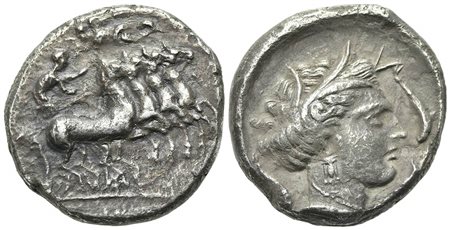 Sicily, Lilybaion (as ‘Cape of Melkart’), ca. 330-305 BC. AR Tetradrachm (g 16,57; mm 26; h 8). Charioteer driving fast quadriga r.; above, Nike flying l., crowning charioteer. R/ Wreathed head of Kore-Persephone r.; four dolphins