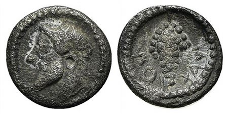 Sicily, Naxos, Litra, ca. 530/20–510 BC. AR (g 1,00; mm 11; h 11). Archaic head of Dionysos l., wearing ivy wreath; Rv. NAXION (retrograde), Grape bunch. Cahn 27; SNG ANS 513; HGC 2, 967. Near very fine