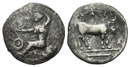 Sicily, Selinos, Litra, ca. 410 BC. AR (g 0.57; mm 11; h 9). Nymph seated l. on rock, r. hand raised above her head, extending her l. hand to touch coiled serpent before her; Rv. Man-headed bull standing r.; in exergue, fish r. SN