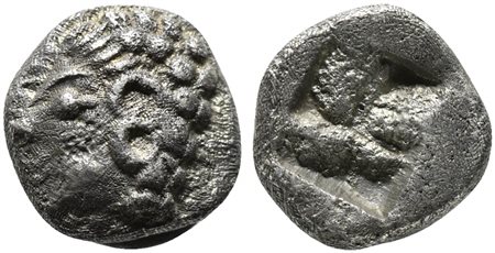 Ionia, Kolophon, Tetartemorion, late 6th century BC; AR (g 0,18; mm 5; h -); Archaic head l.; Rv. Incuse square punch. SNG Kayhan 343-7; SNG von Aulock 1810. Good very fine