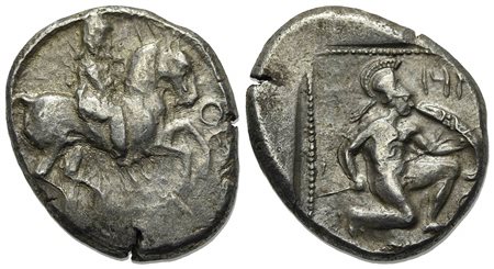 Cilicia, Tarsos, Stater, ca. 410-385 BC. AR (g 10.55, mm 21, h 9). Satrap on horseback r., holding lotus-flower; monogram to r.; Rv. Hoplite kneeling r., wearing Corinthian helmet, holding spear and round shield; all within dotted