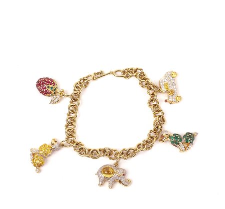 BRACCIALE IN ORO GIALLO 18KT Con cinque charms soggetti diversi in oro,...