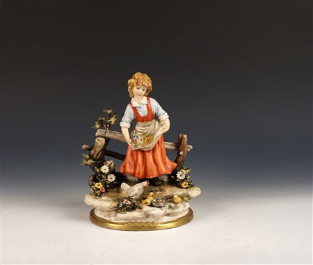 CAPODIMONTE XX Sec. Gruppo in ceramica policroma raffigurante una bambina con...