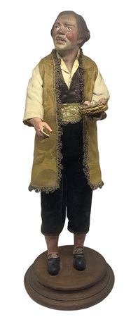 Statuetta napoletana raffigurante uomo con cesta di vimini in mano, viso,...