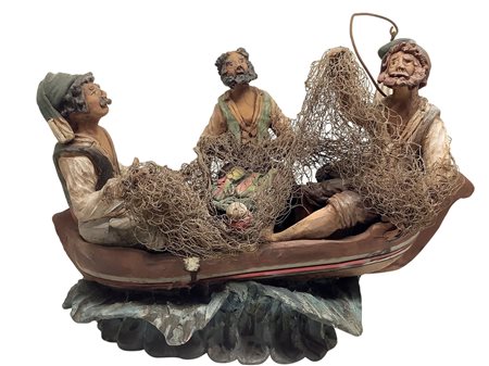 Gruppo scultoreo in terracotta policroma raffigurante tre pescatori in barca,...