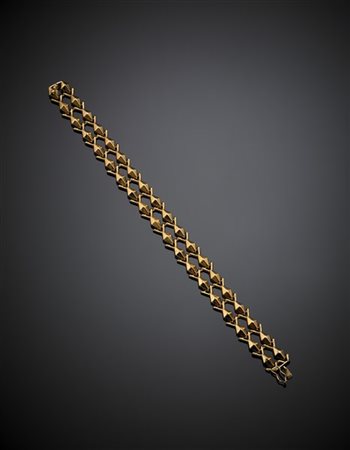 Bracciale modulare in oro giallo, g 14,60 circa, lungh. cm 19 circa. Marcato 72