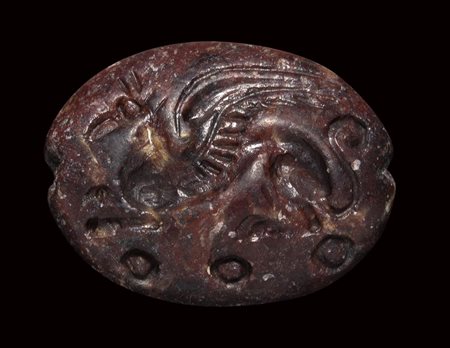 A mycenaean red jasper engraved seal. Griffin. 