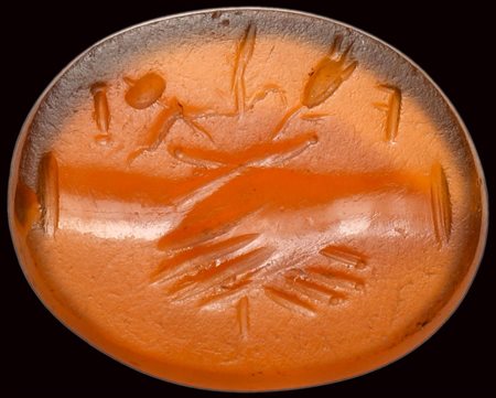 A roman carnelian intaglio. Dextrarum junctio with letters. 