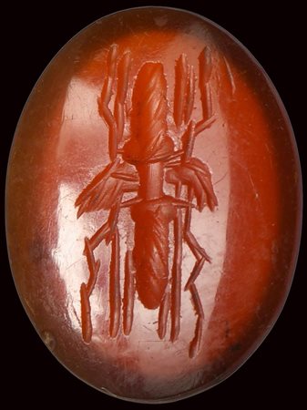 A roman deep red carnelian intaglio. Winged thunderbolt.  