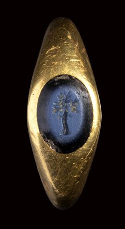 A roman nicolo intaglio set in a massive gold ring. Tree. 