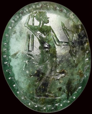 A rare roman emerald intaglio. Artemis with a magical inscription. 