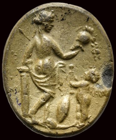 A roman burnt silver impression from an intaglio. Venus victrix with eros. 