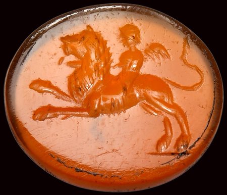 A roman carnelian intaglio. Eros on a lion. 