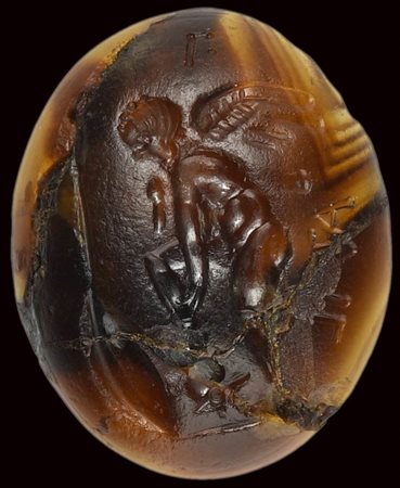 A roman republican agate intaglio. Eros with panoplia. 