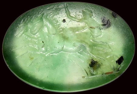 A roman green chalcedony intaglio. Biga.