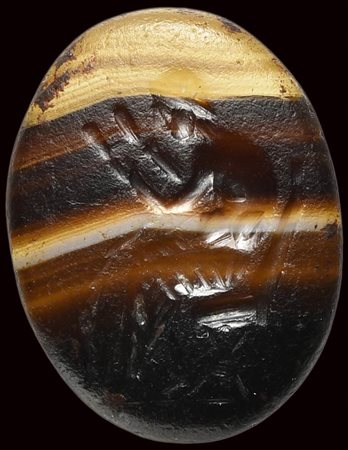 A roman banded agate intaglio. Seated reader. 