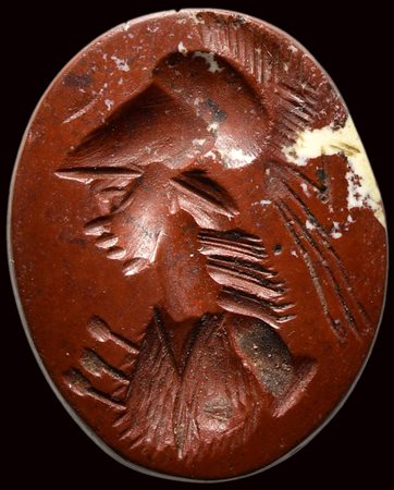 A roman red jasper intaglio. Bust of Athena. 