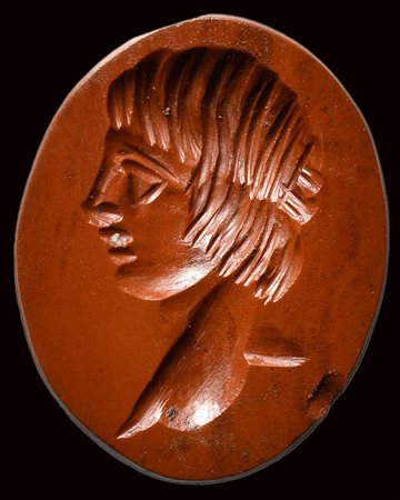 A roman red jasper intaglio. Bust of ephebus. 