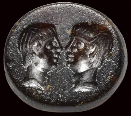 A roman republican sard intaglio. Two male portraits.