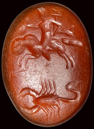 A roman carnelian intaglio. Mercury on the ram with a scorpion.