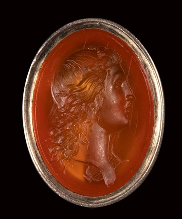 A neoclassical carnelian intaglio mounted on a seal. Bust of Apollo with lyre. 