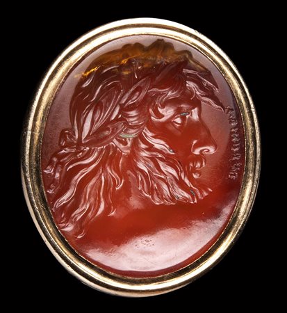 A fine carnelian intaglio seal engraved by Edward Burch. Zeus wearing a laurel wreath.