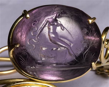 An amethyst Poniatowski intaglio set on a modern gold bracelet with gold impression. 