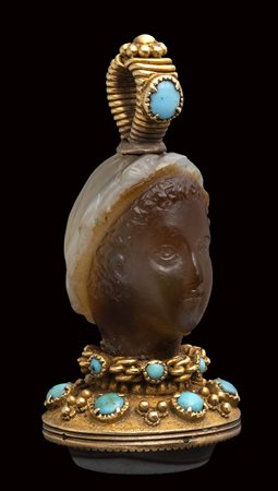 A fine banded agate seal set in a gold mounting with turquoise. Female head. 