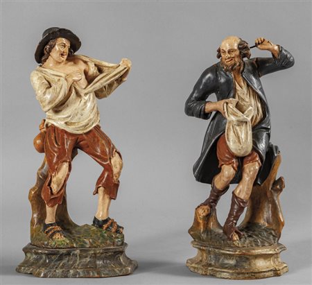 Pitocchi, coppia di figure in legno finemente 