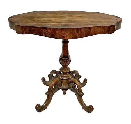 Tavolo da the in legno di palissandro. Base a quattro razze. XIX secolo....