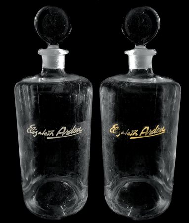 Coppia bottiglie Elizabeth Arden, tonico Rosa. H cm 28. Marchio dell'azienda...