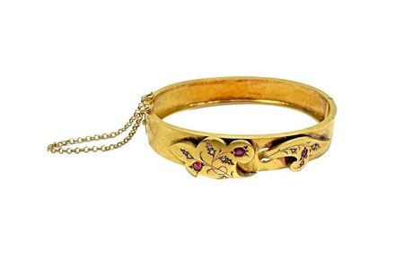 Bracciale in oro giallo con applicazioni in oro rubini e perle. Gr 18,4