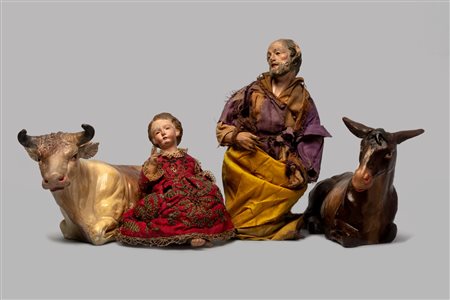 Lotto di quattro sculture da presepe: Gesù Bambino e San Giuseppe (secolo XIX); il bue e l'asinello (secolo XX)