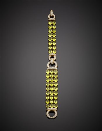 Bracciale in oro giallo e bianco con diamanti e peridoti, g 49,35 circa, lungh.