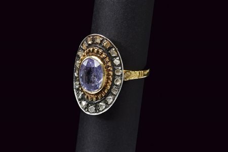 Anello in oro ed argento con zaffiro e diamanti