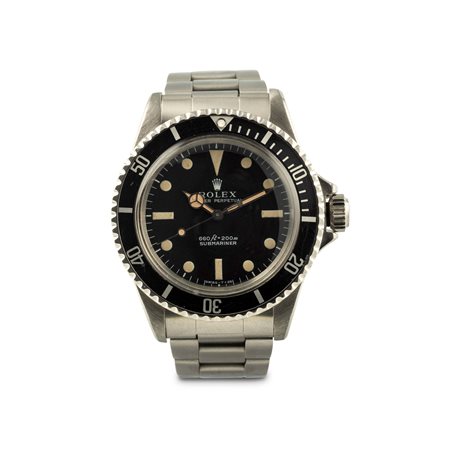 ROLEX - Sumbariner ref 5513 in acciaio con bracciale Oyster, accompagnato da raro astuccio originale e cartellino dell'epoca.