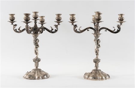 PELLEGRINI, Firenze, XX secolo. Coppia di candelabri in argento 800. Sul...