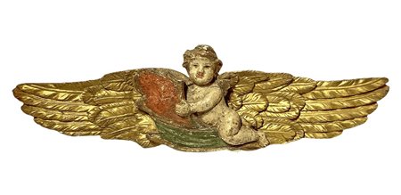 Scultura con angelo policromo in legno laccato e dorato a foglie.