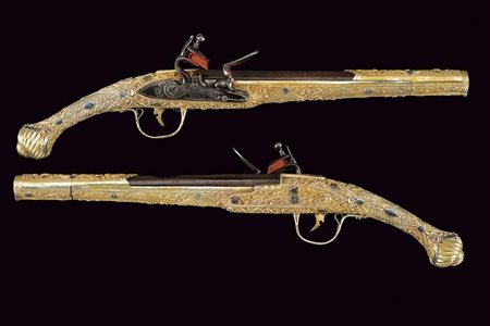 Eccezionale paio di pistole a pietra focaia in argento dorato