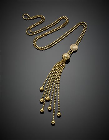 CARTIER
Collier "Draperie" in oro giallo a boules a tenere un pendente rifinito