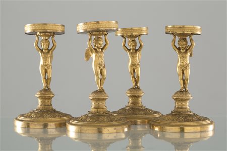 Four gilded bronze stands. Late 19th century