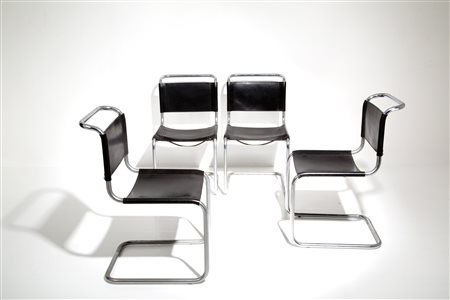 Four chairs in steel and black leather. Italy. '70s