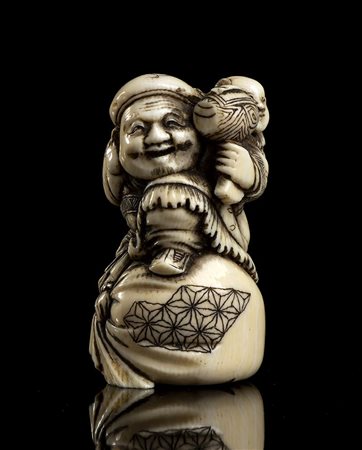 NETSUKE IN AVORIO CON DAIKOKU 
Giappone, periodo Meiji