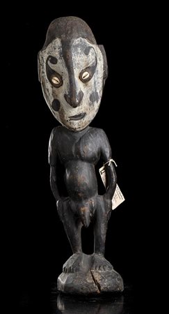 SCULTURA ANTROPOMORFA IN LEGNO E CAURI 
Papua Nuova Guinea, Sepik