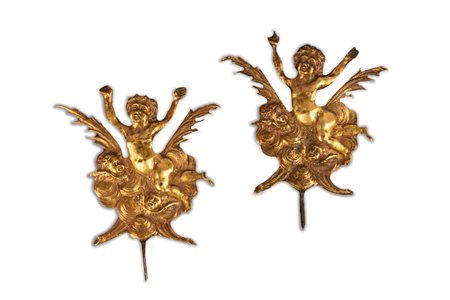 Due placche in bronzo dorato raffiguranti putti e cherubini, secolo XVII