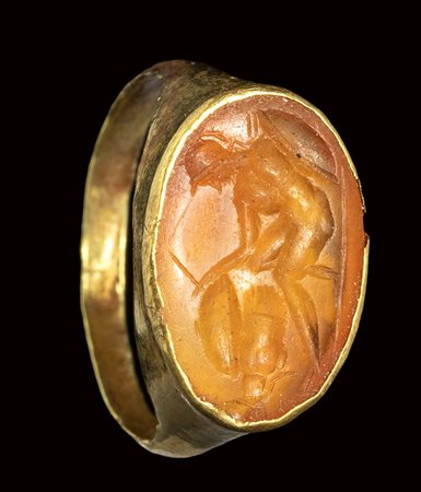 A roman carnelian intaglio set in an ancient gold ring. Warrior. 1st - 2nd century A.D.