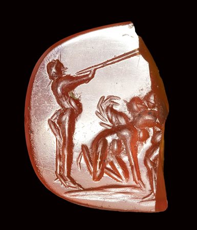 A roman carnelian fragment of an intaglio. Fighting scene with putti.<br><br>2nd century A.D. 