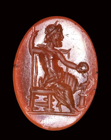 A roman carnelian intaglio. Seated Zeus.<br><br>2nd century A.D.