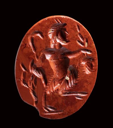 A roman red jasper intaglio. Pan. <br><br>2nd - 3rd century A.D.